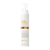 Whipped cream hair treatment bottle, white with orange Milk Shake Moisture label