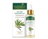 Biotique tea tree treatment face oil bottle with gold dropper, green glass
