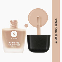 Matte nail lacquer with black cap, beige nude color and attached brush