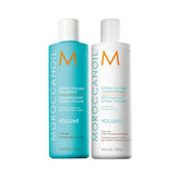Moroccanoil Extra Volume shampoo and conditioner bottles, turquoise and white labels