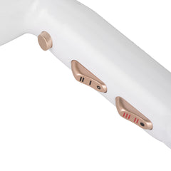 White hair dryer controls with gold-tone buttons and vented grip
