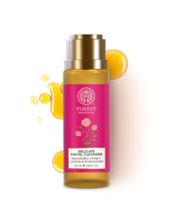 Facial cleanser bottle with gold cap, amber body, and pink label.