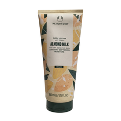 The Body Shop almond milk body lotion tube, 200 ml, beige cream with black cap