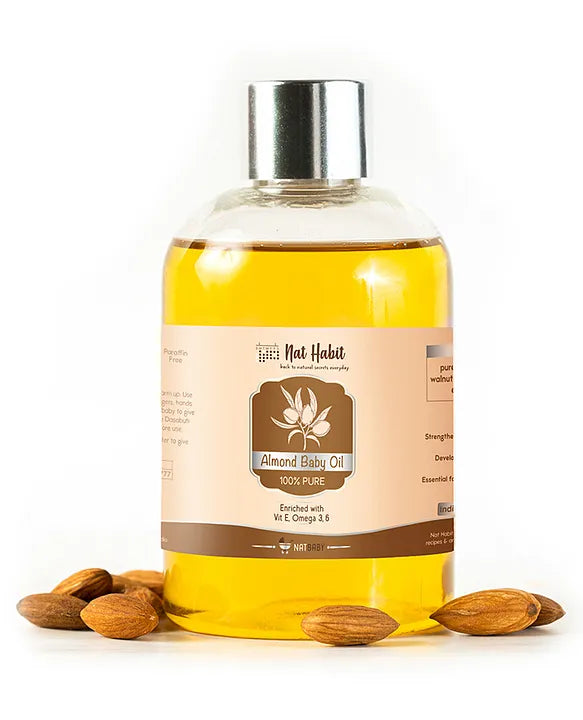 Almond baby oil bottle with amber liquid, silver cap, and Almond Baby Oil label