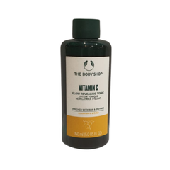 Vitamin C glow revealing tonic bottle, dark green with cream label, 150 ml