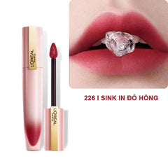 L'Oreal Paris liquid lipstick tube with doe-foot applicator beside berry-red lip swatch