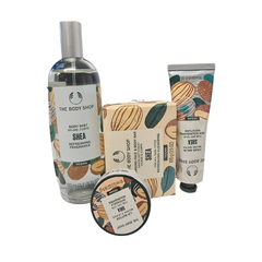 The Body Shop Christmas Shea gift pack with body mist bottle, cream tube, and round tin