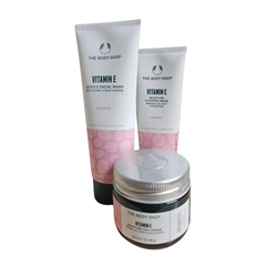 The Body Shop vitamin E skincare trio: cleanser tube, moisturizer tube, body cream jar