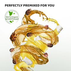 Golden coconut-castor hair oil swirl pouring from a bottle with leaf and shell details