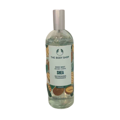 Shea body mist bottle with clear glass, silver cap, and THE BODY SHOP label