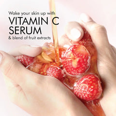 Strawberry vitamin C serum drops on hands