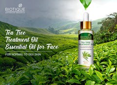 Biotique tea tree treatment face oil bottle, front view with gold dropper