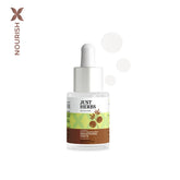 Brightening face serum bottle with white dropper cap and glass body