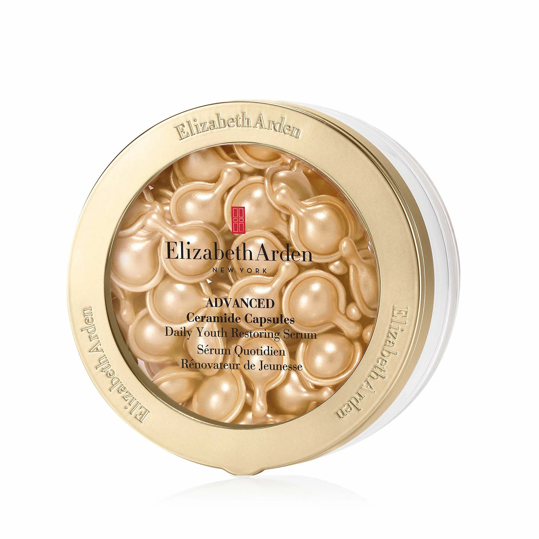 Gold ceramide serum capsule jar lid with Elizabeth Arden branding