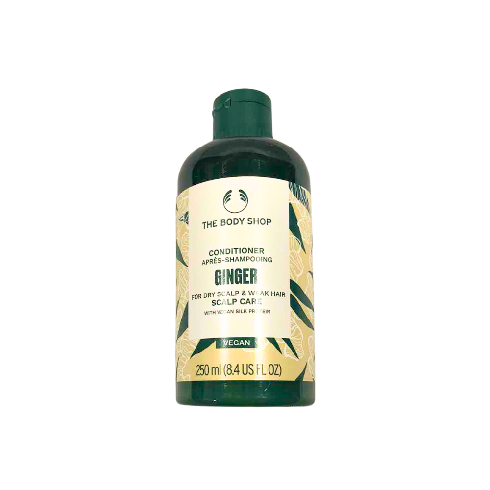 Ginger scalp care conditioner bottle, dark green with gold label and flip-top cap