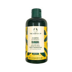 Banana shampoo bottle with dark green cap and yellow label, 250 ml