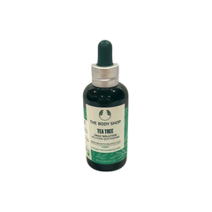 The Body Shop tea tree daily solution bottle, dark green glass, with dropper cap