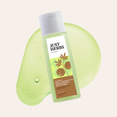 Just Herbs brightening face wash bottle with green label and visible water droplets