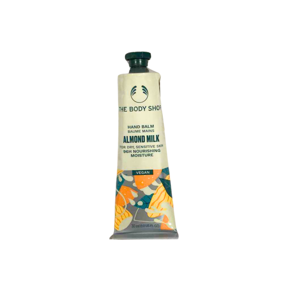 Almond milk hand balm tube with green cap, beige label and citrus pattern
