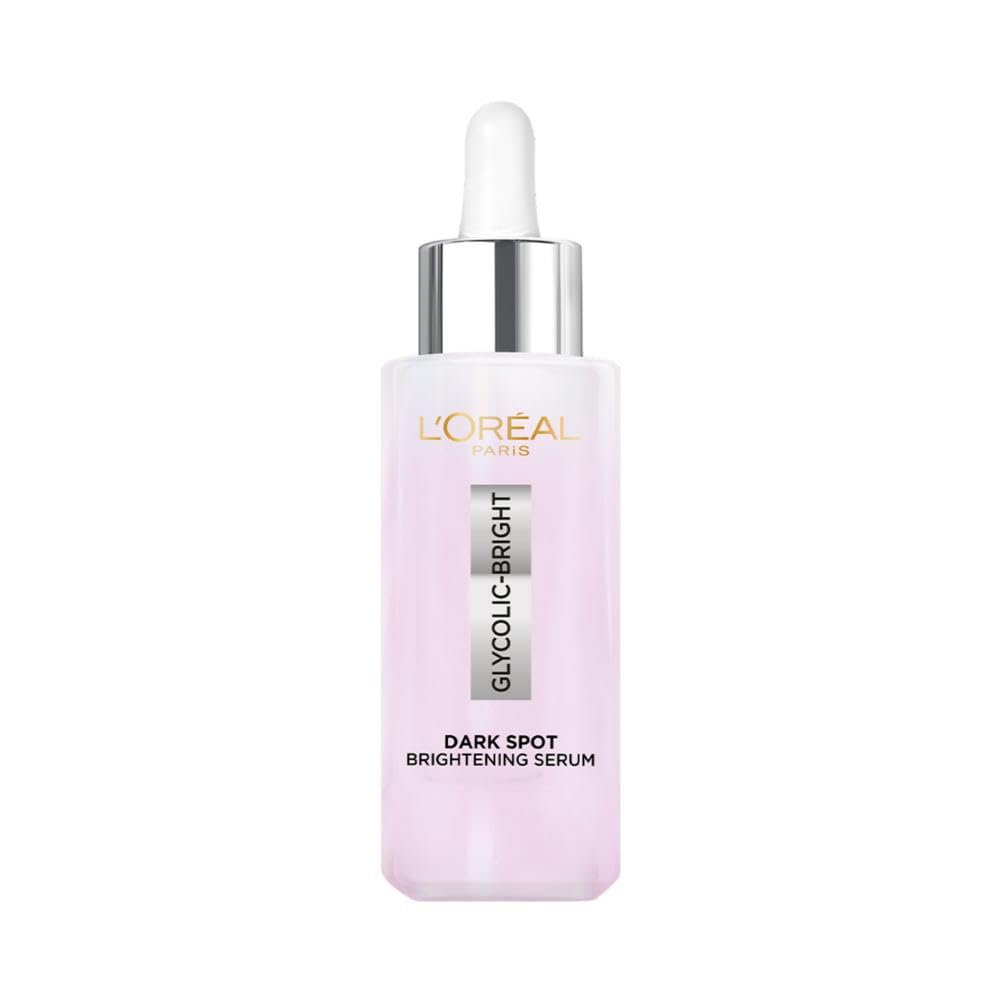 Dark spot brightening serum bottle with white dropper, pink tinted liquid, 15 ml