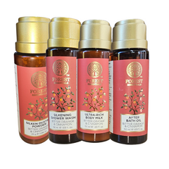 Forest Essentials body care gift set, four bottles with gold caps in front view