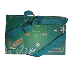 Forest Essentials gift box with teal patterned wrap and ribbon bow, folded view