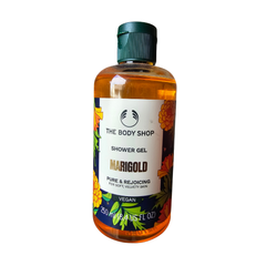 Marigold shower gel bottle with amber liquid and green flip-top cap