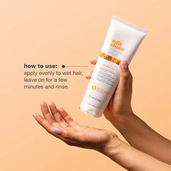 Milk_shake moisture & more conditioner tube in hand, with how to use instructions