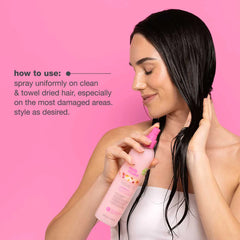 Milk Shake leave-in conditioner spray bottle in use, pink pump spraying hair