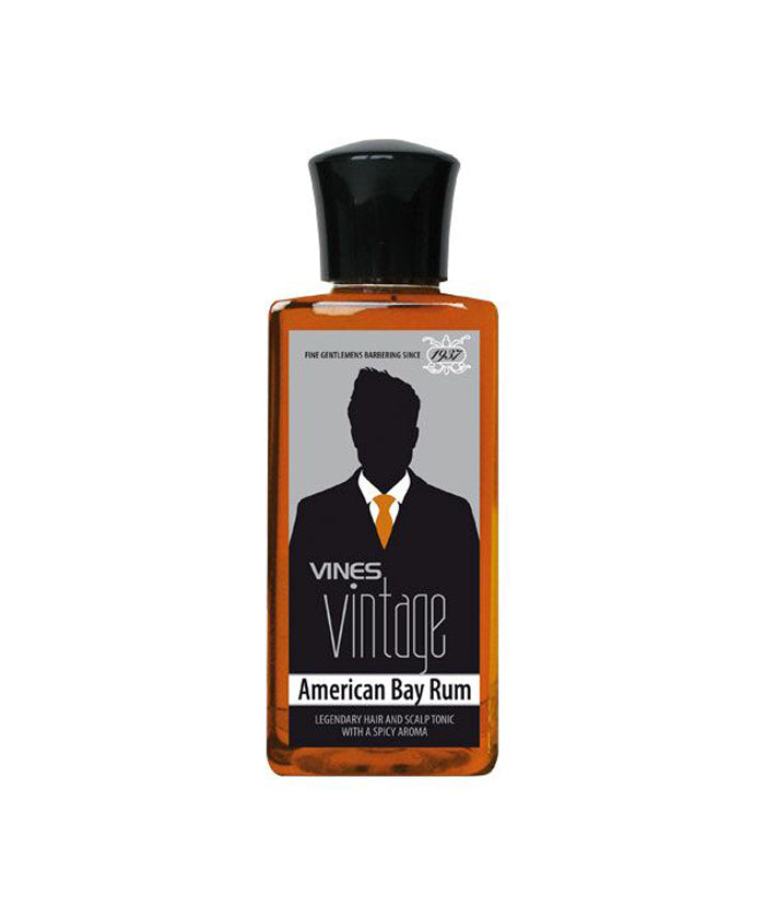Vines Vintage American Bay Rum bottle, amber liquid, black cap