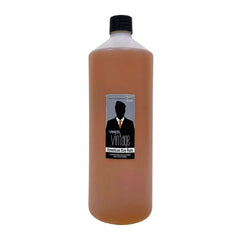 Bay rum bottle, 1 litre, black cap, amber liquid, branded label