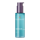 Hair serum bottle with teal body and purple pump dispenser