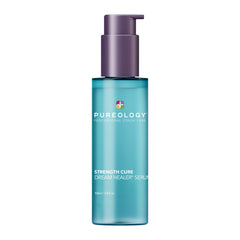 Hair serum bottle with teal body and purple pump dispenser