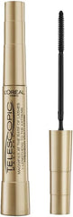 Gold mascara tube with upright black bristle brush