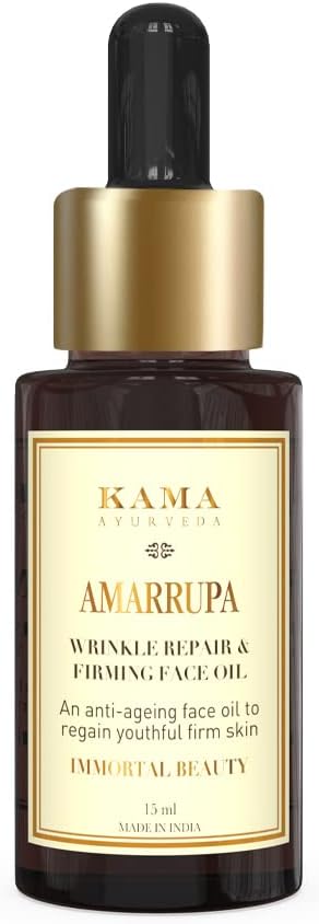 Kama Ayurveda face oil bottle with gold cap and amber glass