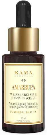 Kama Ayurveda face oil bottle with gold cap and amber glass