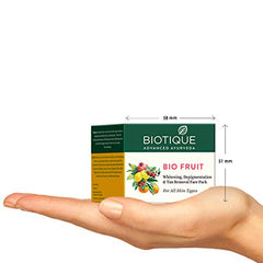 Biotique fruit face pack box and jar on forearm with dimension arrows 58 mm