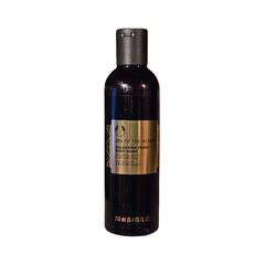 Body wash bottle with dark bottle, gold label, and black cap, 250 ml