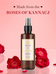 Rose water mist bottle with silver spray pump and front label on amber glass