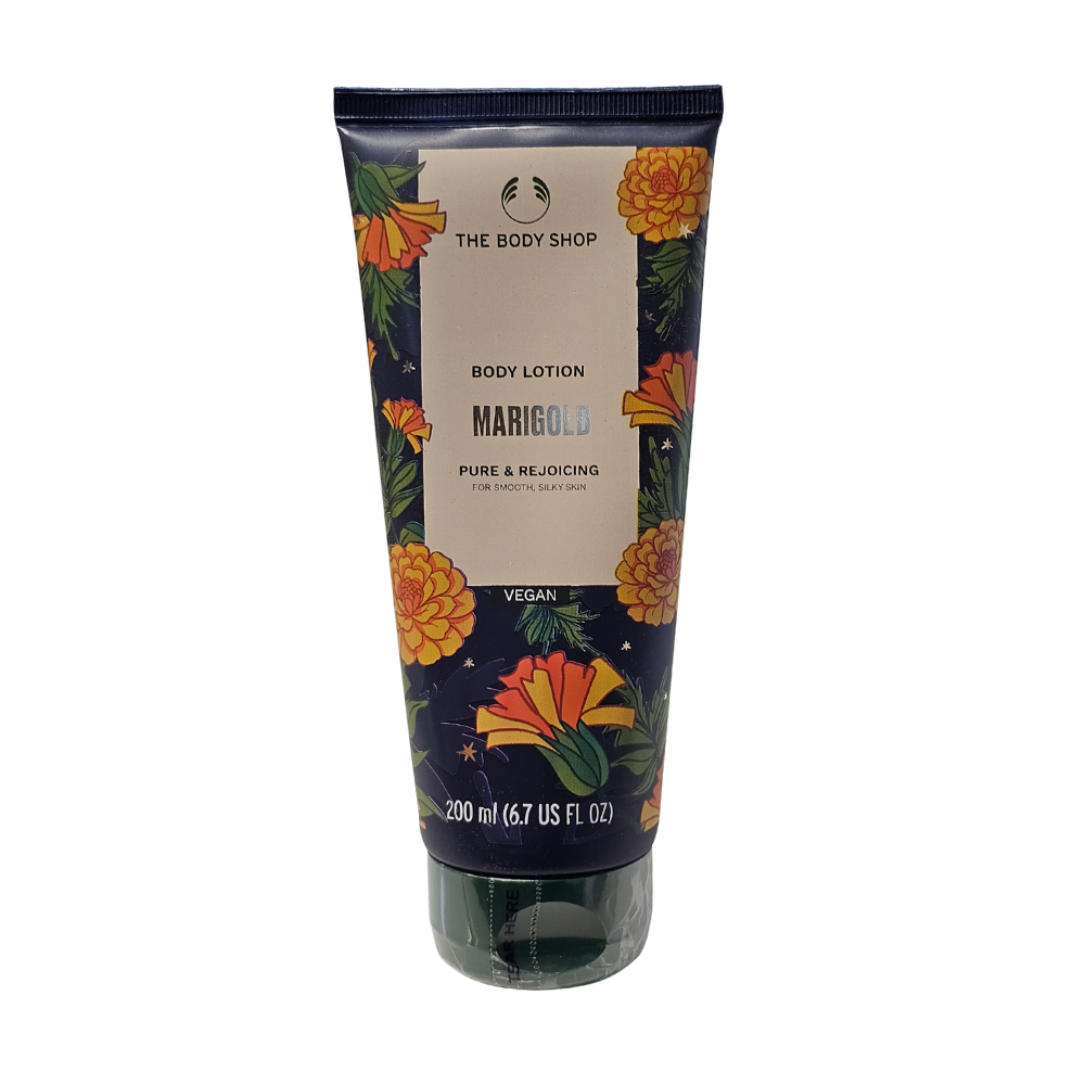 The Body Shop marigold body lotion tube, dark blue with floral print