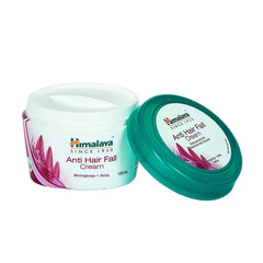 Anti hair fall cream jar with green lid and white body, lid shown beside jar, 100 ml.