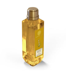 Forest Essentials almond oil bottle, gold cap, amber bottle with front label