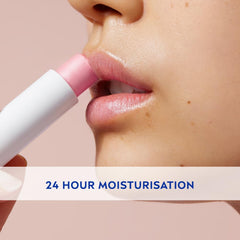 NIVEA Soft Rosé lip balm being applied to lips with rose-pink tint.