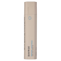 Davroe anti-frizz shampoo and conditioner bottle, tall beige cylinder with blue label