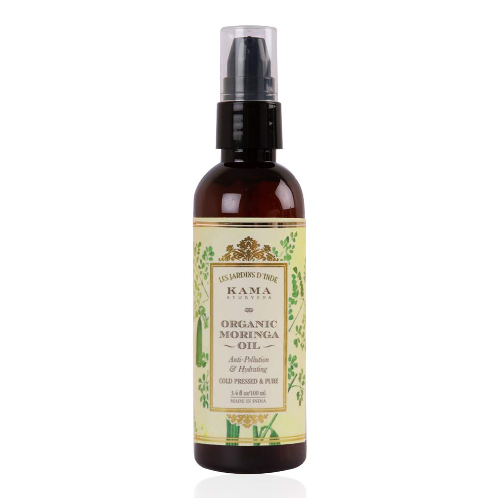 Organic moringa skin oil bottle with pump, amber glass, front label design
