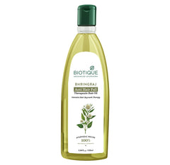 Therapeutic hair oil bottle with green cap and front label, 100 ml