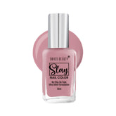 Lavender-toned nail polish bottle with silver cap and square glass base