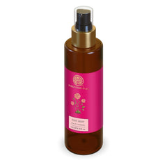 Body mist bottle with gold pump, pink label, brown glass