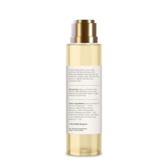After bath oil bottle with gold pump and back ingredient text panel