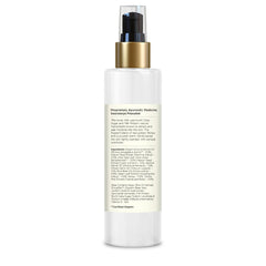 Body milk bottle with gold pump and white back panel with ingredient information
